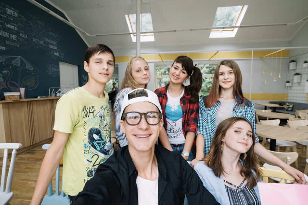 student taking photo with classmates 2